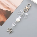 Llavero creativo de perlas y conchas con lazo transparente y cuentas de corazón - Blanco