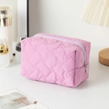 Pink quilted fabric cosmetic bag with silver zipper for travel and makeup storage - Light Purple