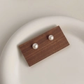 French vintage white baroque natural pearl stud earrings on a dark wooden display stand - Style 16