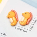 Detail view of resin seahorse charms with 2.4cm height dimensions for DIY jewelry - Small Seahorse