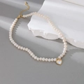 Elegant rice freshwater pearl necklace featuring a golden heart pendant with shell inlay - Gold Heart Shell Pendant Style (W-d-008)