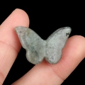 Polished grey-green labradorite stone carved in butterfly shape with natural textures - Labradorite
