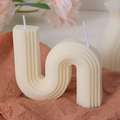Minimalist cream white double-wick wavy geometric candle with textured ribbed patterns - S-Shaped