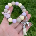 Beaded wristlet keychain with macaron silicone beads, elk charm, and leather tassel - Light Purple