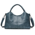 Teal blue vintage soft leather handbag with cross-stitch design and adjustable strap - Blue