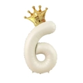 Detail of a cream number 6 balloon with a golden crown for kid's birthday party decor - Number 6