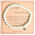Pale green natural stone bead bracelet with a silver heart charm on a gift card - Light Green Matte Stone With Card Style