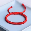 Handcrafted red cord bracelet with traditional diamond knot in a ceramic dish - Adult Size (14-15cm) / Red