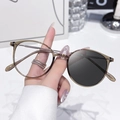 Light brown round anti-blue light glasses with photochromic lenses in a retro style - Photochromic Grey / Tea Silver Frame