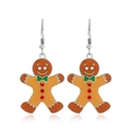 Macro detail of gingerbread man earrings with orange enamel and red rhinestone accents - Size #16