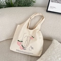 Artistic canvas tote bag with peach graphic displayed in a cozy lifestyle setting - Peach
