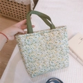 Detail einer floralen Lunchtasche mit grünen Canvas-Griffen und Metalldruckknopf - Gansgelb Floral