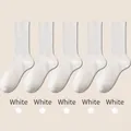 Five pairs of white cotton blend mid-calf socks with ribbed cuffs and elastic texture - One Size / White
