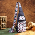 Close-up of bohemian sling bag with geometric patterns and colorful wide shoulder strap - Dark Blue Ethnic