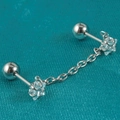 Macro detail of stainless steel barbell earring with star zircon and linked silver chain - 0.8x6x4mm / Silver Double Star Zircon