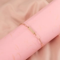 Detailed view of rose gold paperclip link bracelet with a polished rectangular nameplate - Rose Gold