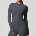 Detail of slim-fit dark grey sports jacket with thumbhole cuffs and mock neck design - Graphite Grey