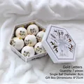 Set of 7 white 8cm Christmas balls with gold Happy Holidays print in hexagonal gift box - Gold Alphabet 7pcs