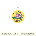 Round yellow diatom mud coaster featuring a cartoon snail with Fancy text print - Skating Snail