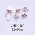 Detailed view of silver bow nail charms with 12x10mm pink heart rhinestones - Silver Base Starry Pink Red Heart (9460)