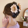 Dusty pink floral hair claw clip shown in a stylish half-up hairstyle - Brown Large Flower with Yellow Stamen (Claw Clip)