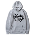 Detail of grey hoodie with Spooky Vibes text and bat print plus M size label - Light Gray