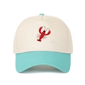 Close-up of red lobster embroidery on a two-tone cotton baseball trucker hat - Lake Blue