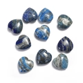 Flat lay of polished heart-shaped lapis lazuli stones with natural golden mineral textures - Lapis Lazuli