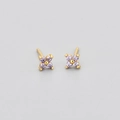 Macro shot of gold four-leaf flower earrings with lavender round-cut zircon stones - Gold Color Purple Zirconia