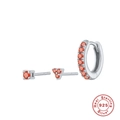 Detailed macro view of S925 sterling silver trinity earrings with bright orange zircon stones - Silver-Orange Red Zirconia