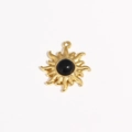 Macro shot of gold sunflower pendant with black gemstone and textured metal rays - Sunflower Radial Inlaid Black Gemstone (Style 5)