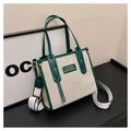 Detail of canvas tote bag with green leather trim and adjustable wide shoulder strap - Green Small