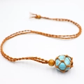 Handmade woven net necklace featuring a turquoise stone bead with brown cord detail - Turquoise