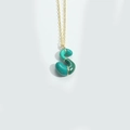 Golden necklace featuring a green enamel puffy balloon pendant in the shape of letter S - Letter S