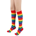 Knee-high rainbow striped cotton socks for women shown on model with white background - Red Trim
