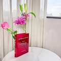 Red acrylic book-shaped flower vase with gradient finish and white typography print - Red