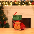 Detail of red Christmas stocking with green sequins and a 3D plush reindeer on wood - Sequin Reindeer Small Sock
