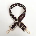 Macro detail of geometric jacquard bag strap #13 with premium gold metal swivel hooks - Pattern No. 13