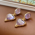 Macro detail of vintage gold textured oval earrings with purple heart charms - Heart Hammered Pendant Style (24#) / Purple