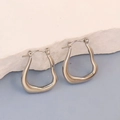 Modern irregular wave-shaped silver stainless steel hoop earrings with polished finish - Silver Style K7-39