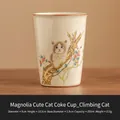 Tazza in ceramica Ru-kiln bianco crema con trama a crepe di ghiaccio e design a gatto - Imballaggio Semplice / Fiore Rosso Gatto Che Si Arrampica