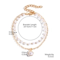 Detail shot of golden double-layer bracelet with pearls and circular pendant size specs - S2407-5 Double KC Gold