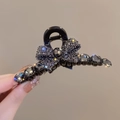 Detail of a grey bow hair claw clip with rhinestones and a large faceted gemstone - Full Rhinestone Butterfly 11cm