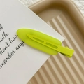Close-up of a matte fluorescent green seamless hair clip on a white display card - Neon Green