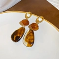 Close-up of vintage resin amber teardrop earrings with golden metal stud details - Coffee Droplet (11# Silver Earring Post)