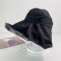 Detail view of large brim sun hat with ruffled edges on a white mannequin stand - M (56-58cm) / Black