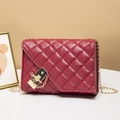 Quilted burgundy shoulder bag with gold chain strap and elegant metallic lock detail - Red