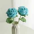 Handmade crochet rose bouquet with two blue flowers in a white textured vase - Woven Rose (Finished) / Light Blue (Toothed Large Leaf with Wire)