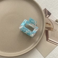Detail of square hollow hair claw clip with blue marble pattern on ceramic plate - Small Square Claw / Pale Blue