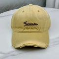 Detail of embroidered Fantastic lettering and distressed brim on light yellow baseball cap - One Size (58-60cm) / Khaki